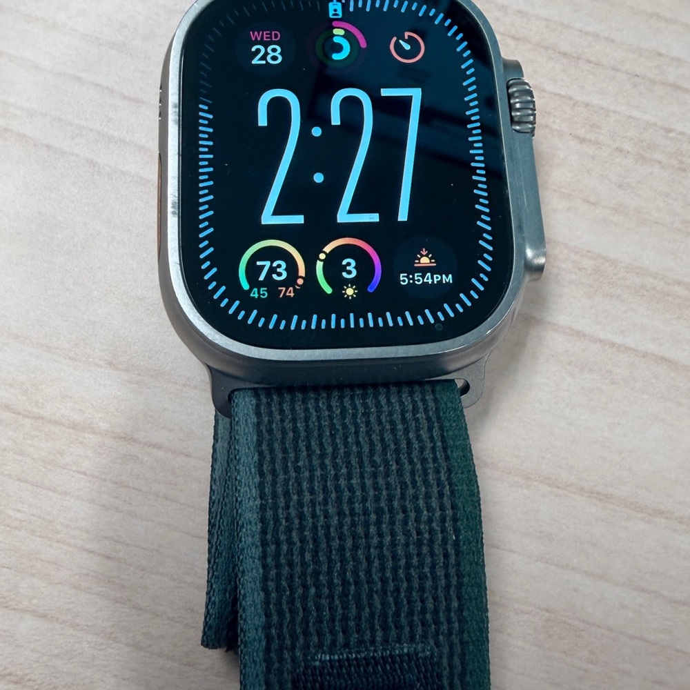 Apple Watch Ultra with Dark Green Sport Loop and Silver Case